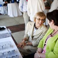 Executive Assistant to Superintendent JoAnn Emmendorfer talks with Executive Assistant to Board of Education Amy Osinski while guests check in the the Ann Arbor Public School retirement party on Tuesday, June 18. Daniel Brenner I AnnArbor.com